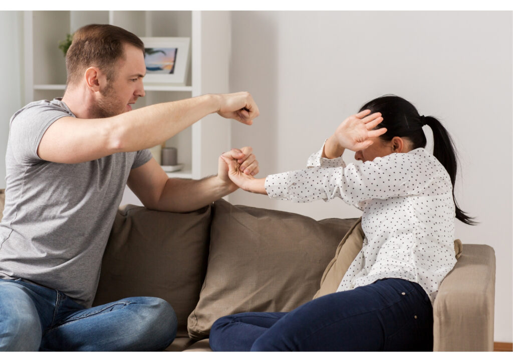 This photo features a man raising his hand to his partner