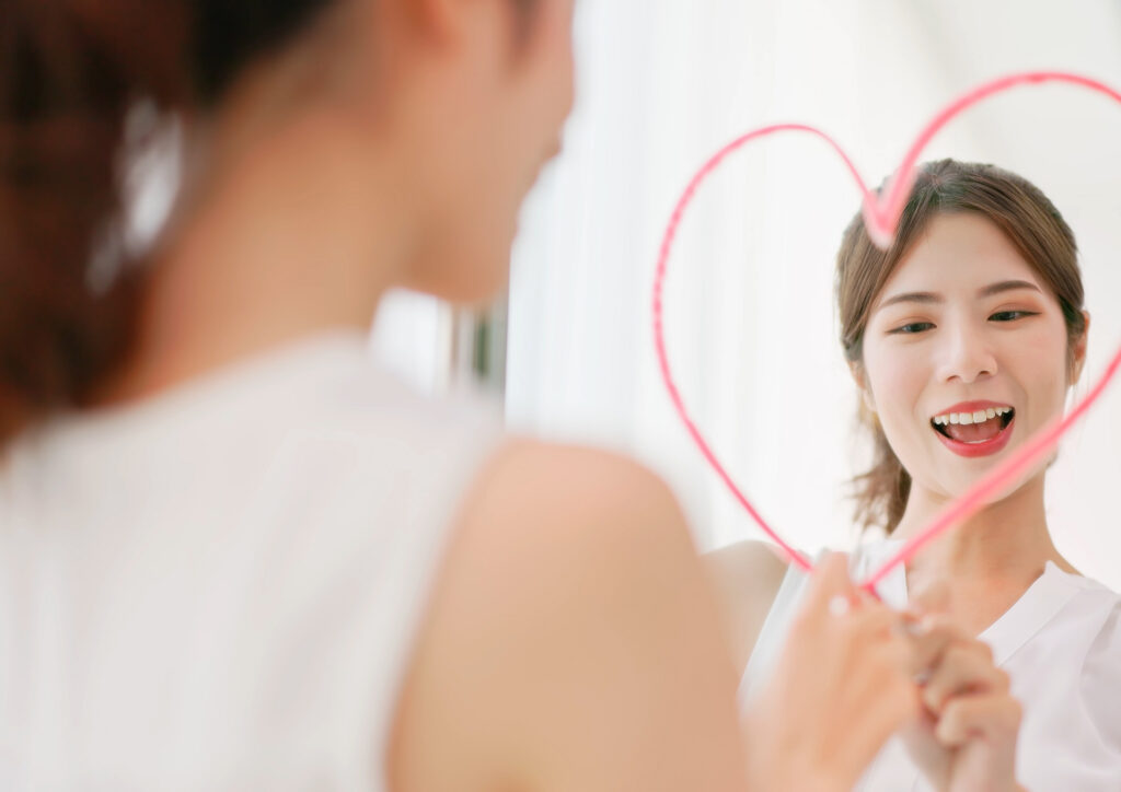 the photo shows a woman smiling to herself. 