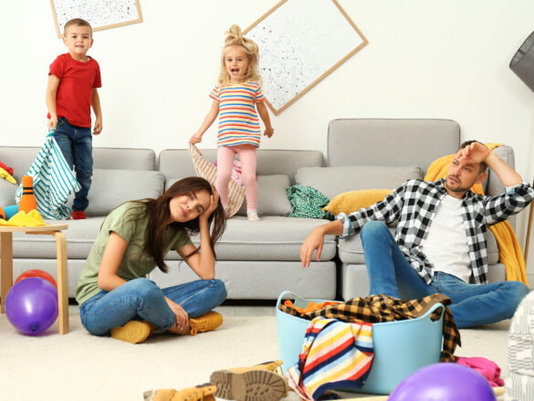 This photo is used to represent discipline to toddlers. The photo shows a family with exhausted parents.