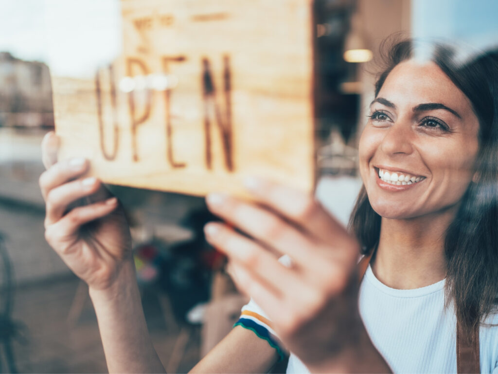 This photo is used to represent a small business. The photo shows a woman buyer looking at the laptop.