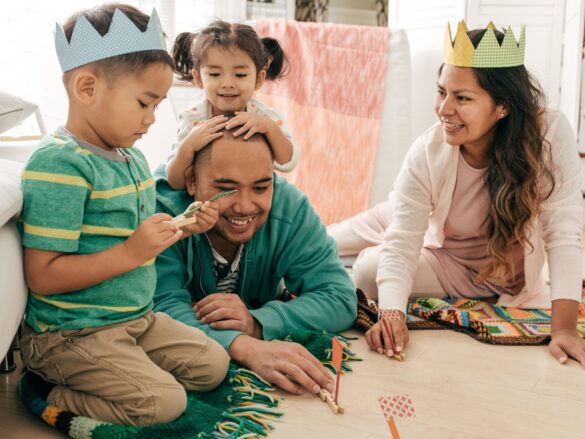 This photo is used to represent fun activities for kids. The photo shows a family spending time together.