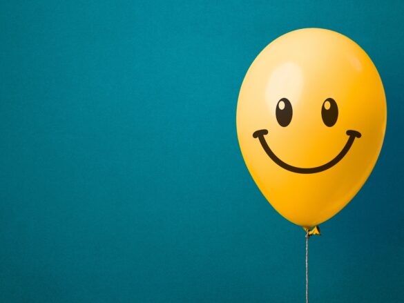 this photo is used to represent happiness. The photo contains a balloon smiling.