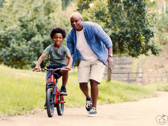 This photo is used to represent teaching ride a bike.